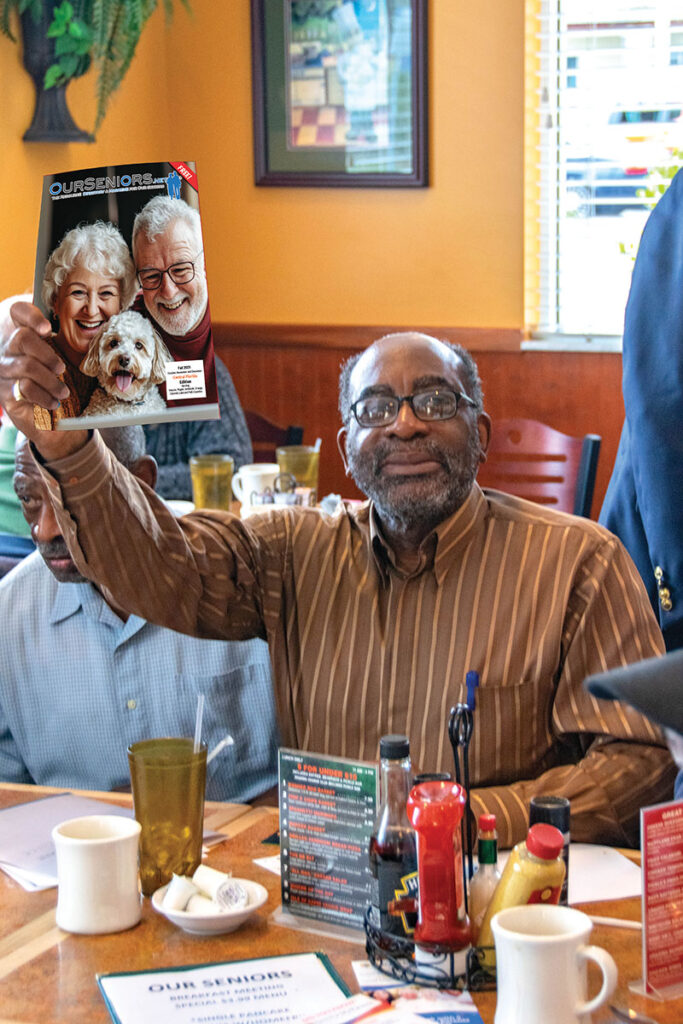 Black Gentleman Holding Magazine